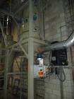 Used Conair Model CR1000 Crystallizer rated at 1000 lbs per hour.  Includes approximately 3500 lb agitated hopper, operator control panel and heater / cooler unit with blower.