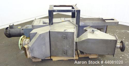 Used Carter Day Spin-Away Spin Dryer, Model CWM2, 304 Stainless Steel. Driven by a 5hp, 3/60/208230/460 volt, 1160 rpm motor. Includes an Agglomerate unit, model DAS2, and a carbon steel stand.