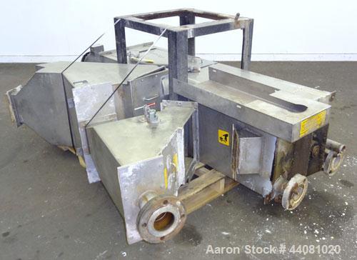 Used Carter Day Spin-Away Spin Dryer, Model CWM2, 304 Stainless Steel. Driven by a 5hp, 3/60/208230/460 volt, 1160 rpm motor. Includes an Agglomerate unit, model DAS2, and a carbon steel stand.