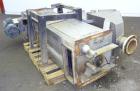 Used Carter Day Spin-Away Spin Dryer, Model DBA2, 304 Stainless Steel. Driven by a 5hp, 3/60/230/460 volt, 1730 rpm motor. Includes an Agglomerate unit, model AU200, and a carbon steel stand.