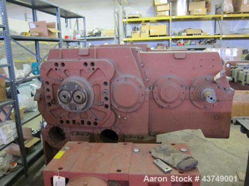 Used Werner Pfleiderer Twin Screw Gearboxes (3) and Thrust Bearing Assemblies.  Additional parts include one base for 160 mm.  Lot various barrels, heaters, shafts, screw elements and barrel supports.