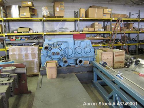 Used Werner Pfleiderer Twin Screw Gearboxes (3) and Thrust Bearing Assemblies.  Additional parts include one base for 160 mm.  Lot various barrels, heaters, shafts, screw elements and barrel supports.