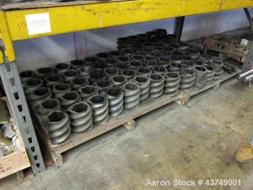Used Werner Pfleiderer Twin Screw Gearboxes (3) and Thrust Bearing Assemblies.  Additional parts include one base for 160 mm.  Lot various barrels, heaters, shafts, screw elements and barrel supports.