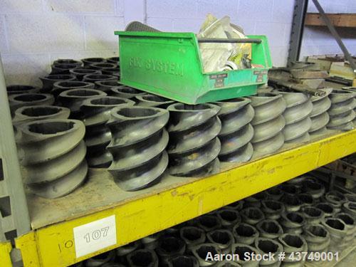 Used Werner Pfleiderer Twin Screw Gearboxes (3) and Thrust Bearing Assemblies.  Additional parts include one base for 160 mm.  Lot various barrels, heaters, shafts, screw elements and barrel supports.