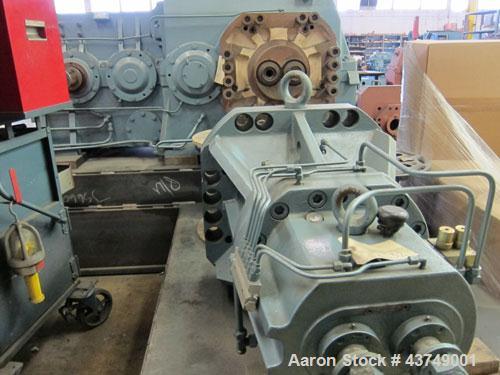 Used Werner Pfleiderer Twin Screw Gearboxes (3) and Thrust Bearing Assemblies.  Additional parts include one base for 160 mm.  Lot various barrels, heaters, shafts, screw elements and barrel supports.