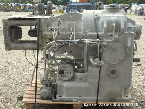 Used Werner Pfleiderer Co-Rotating Design Gearbox, type ZSK-83-R240P, rated 149 kW. Center to center on output shafts approximately 3" (76.2mm), outer diameter of spline 1.957" (49.71 mm), height fro...