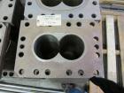 Used Werner Pfleiderer Twin Screw Gearboxes (3) and Thrust Bearing Assemblies.  Additional parts include one base for 160 mm.  Lot various barrels, heaters, shafts, screw elements and barrel supports.