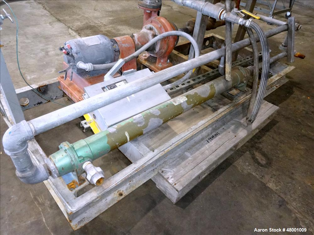 Used Lube Systems Inc. Water System. Consisting of pump, tank and heat exchanger. Mounted on a carbon steel frame.