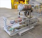 Used Lube Systems Inc. Water System. Consisting of pump, tank and heat exchanger. Mounted on a carbon steel frame.