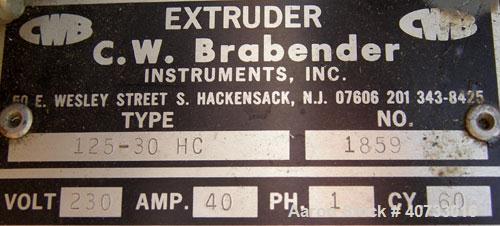 Used C.W. Brabender 1" Single Screw Extruder, type 125-30 HC.  4 zone, approximate 37:1 L/D.  6" x 6" feed hopper.  Driven by a 1/4 hp, 90 volt, 1725 rpm DC adjustable speed motor.  Includes a contro...