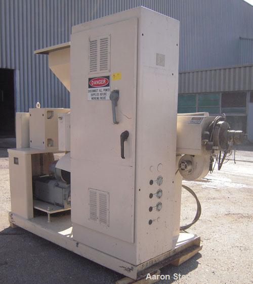 Used Akron 2 1/2" Single Screw Extruder, Model PAK250, approximately 24 to 1 L/D ratio. Electrically heated, air cooled 4 zone non-vented barrel. Water cooled feed throat, with hopper. Approximately ...