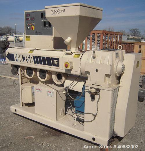 Used Akron 2 1/2" Single Screw Extruder, Model PAK250, approximately 24 to 1 L/D ratio. Electrically heated, air cooled 4 zone non-vented barrel. Water cooled feed throat, with hopper. Approximately ...