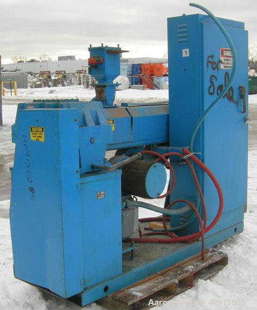Used Akron 2 1/2" Single Screw Extruder Model PAK 250. Approximate 24:1 L/D ratio. Electrically heated, air cooled 4 zone non-vented barrel. Water cooled feed throat, no hopper. Driven by a 40 hp, 50...
