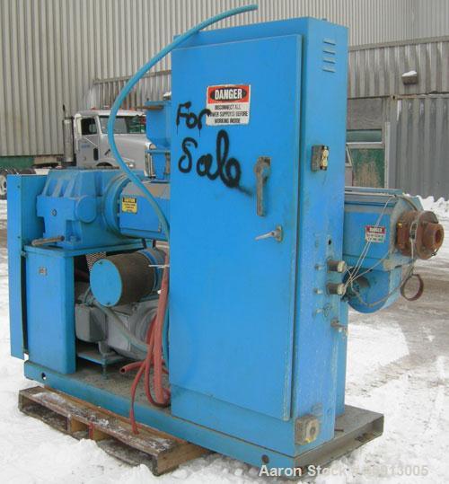 Used Akron 2 1/2" Single Screw Extruder Model PAK 250. Approximate 24:1 L/D ratio. Electrically heated, air cooled 4 zone non-vented barrel. Water cooled feed throat, no hopper. Driven by a 40 hp, 50...