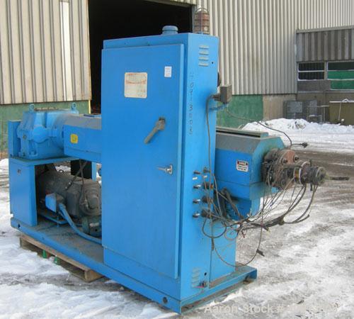 Used Akron 3 1/2" Single Screw Extruder, model PAK350. Approximate 24:1 L/D ratio.  Electrically heated, air cooled 5 zone non-vented barrel. Water cooled feed throat, no hopper. Driven by a 75 hp, 3...