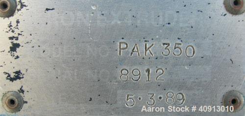 Used Akron 3 1/2" Single Screw Extruder, model PAK350, approximate 24:1 L/D ratio. Electrically heated, air cooled 5 zone non-vented barrel. Water cooled feed throat, no hopper. Driven by a 75 hp, 30...