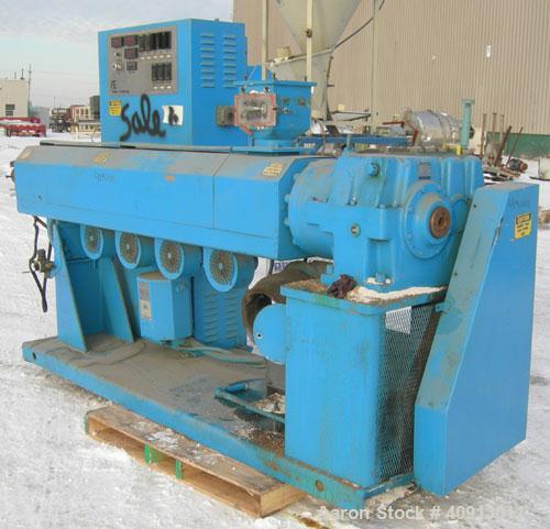 Used Akron 3 1/2" Single Screw Extruder, model PAK350. Approximate 24:1 L/D ratio. Electrically heated, air cooled 5 zone air non-vented barrel. Water cooled feed throat with magnet, no hopper. Drive...
