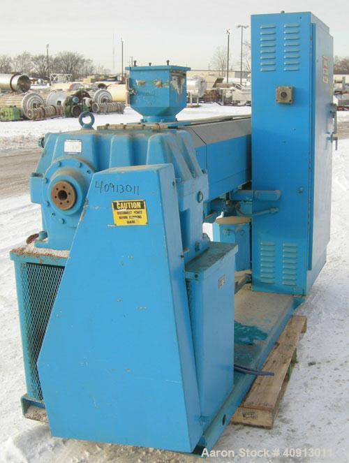 Used Akron 3 1/2" Single Screw Extruder, model PAK350. Approximate 24:1 L/D ratio. Electrically heated, air cooled 5 zone air non-vented barrel. Water cooled feed throat with magnet, no hopper. Drive...