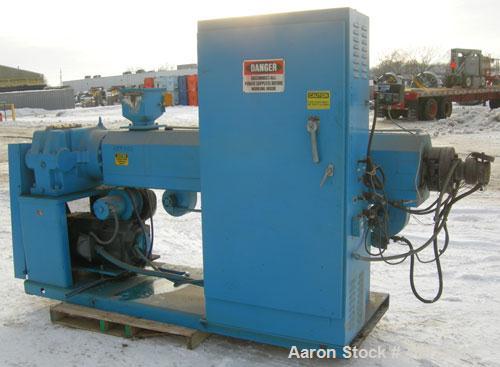 Used Akron 3 1/2" Single Screw Extruder, model PAK350. Approximate 24:1 L/D ratio. Electrically heated, air cooled 5 zone air non-vented barrel. Water cooled feed throat with magnet, no hopper. Drive...