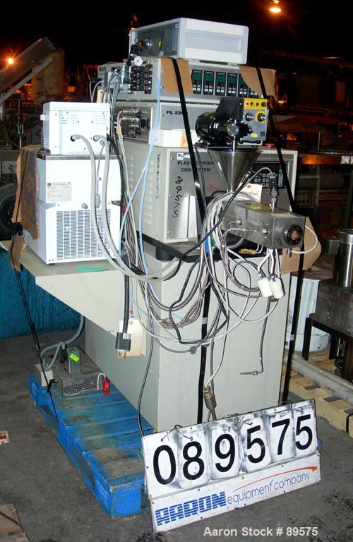 USED: Brabender lab size extrusion system consisting of: (1) Brabender 3/4" single screw extruder, model 2003. Approximate 20:1 L/D ratio, electrically heated, air cooled barrel. (1) Brabender model ...