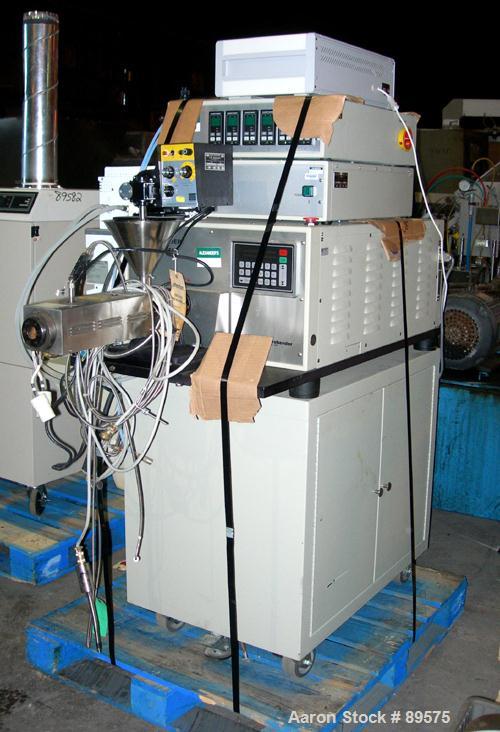 USED: Brabender lab size extrusion system consisting of: (1) Brabender 3/4" single screw extruder, model 2003. Approximate 20:1 L/D ratio, electrically heated, air cooled barrel. (1) Brabender model ...