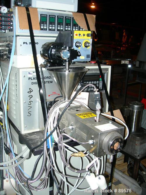 USED: Brabender lab size extrusion system consisting of: (1) Brabender 3/4" single screw extruder, model 2003. Approximate 20:1 L/D ratio, electrically heated, air cooled barrel. (1) Brabender model ...