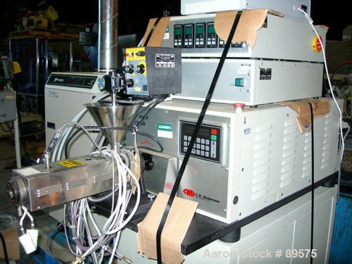 USED: Brabender lab size extrusion system consisting of: (1) Brabender 3/4" single screw extruder, model 2003. Approximate 20:1 L/D ratio, electrically heated, air cooled barrel. (1) Brabender model ...