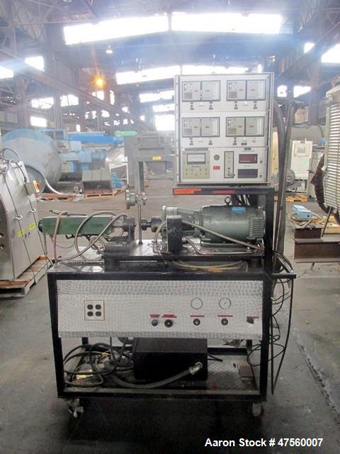 Used Brabender Laboratory Extruder, Type SP-TP250. Electrically heated, water cooled barrel. .75" dia serial 1370Driven by a 3hp DC motor with controller. Includes temperature controllers. Serial# 13...