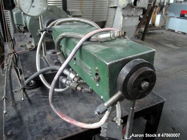 Used Brabender Laboratory Extruder, Type SP-TP250. Electrically heated, water cooled barrel. .75" dia serial 1370Driven by a 3hp DC motor with controller. Includes temperature controllers. Serial# 13...