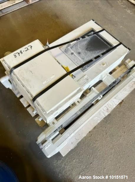 Used 100mm Buss kneader with 9/1 L/D barrel. Driven by 200 hp DC motor, includes 5.94/1 gearbox, jacketed barrel and clam shell barrel opening. Includes operator control panel. Kneader will discharge...