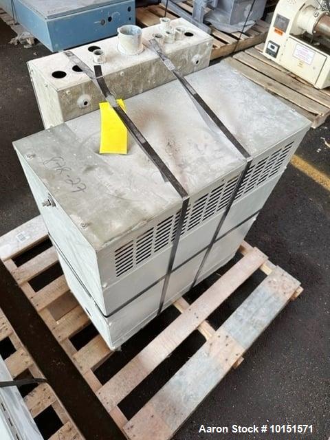 Used 100mm Buss kneader with 9/1 L/D barrel. Driven by 200 hp DC motor, includes 5.94/1 gearbox, jacketed barrel and clam shell barrel opening. Includes operator control panel. Kneader will discharge...