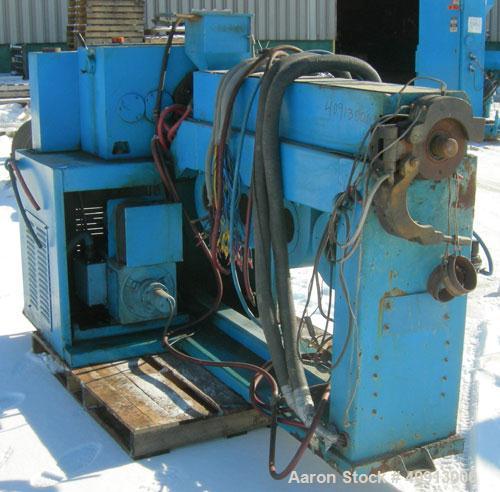 Used Cosmo 2 1/4" Single Screw Extruder. Approximate 26:1 L/D ratio. Electrically heated, air cooled 4 zone non-vented barrel. Water cooled feed throat, no hopper. Driven by a 20 hp, 440 volt, 2810 r...