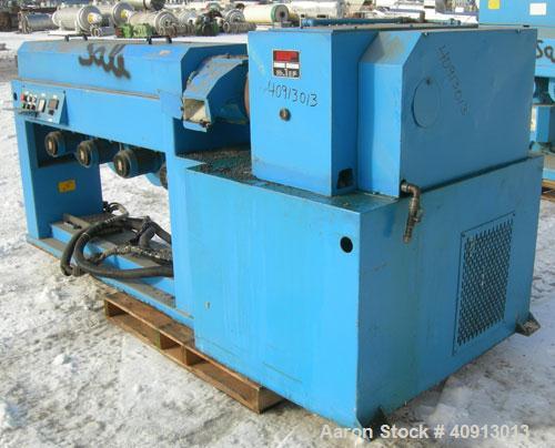 Used Cosmo 2 1/2" Single Screw Extruder, Approximate 30:1 L/D Ratio. Electrically heated, air cooled 4 zone non-vented barrel. Water cooled feed throat, no hopper. Driven by an approximate 20 HP DC m...