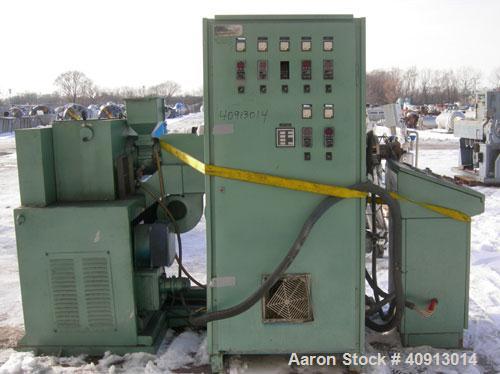 Used Cosmo 2" Single Screw Extruder, Approximate 30:1 L/D Ratio. Electrically heated, air cooled 4 zone non-vented barrel. Water cooled feed throat with magnet, no hopper. Driven by an approximately ...