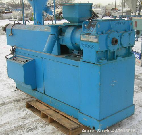 Used Cosmo 2 1/2" Single Screw Extruder. Approximately 30:1 L/D ratio. Electrically heated, air cooled 4 zone non-vented barrel. Water cooled feed throat with magnet, no hopper. Driven by a 4/40 hp, ...