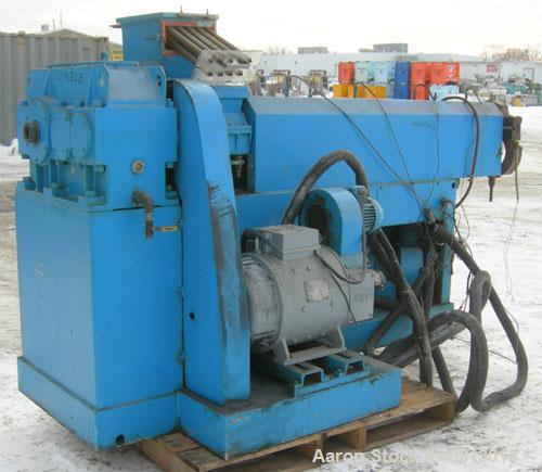 Used Cosmo 2 1/2" Single Screw Extruder. Approximately 30:1 L/D ratio. Electrically heated, air cooled 4 zone non-vented barrel. Water cooled feed throat with magnet, no hopper. Driven by a 4/40 hp, ...