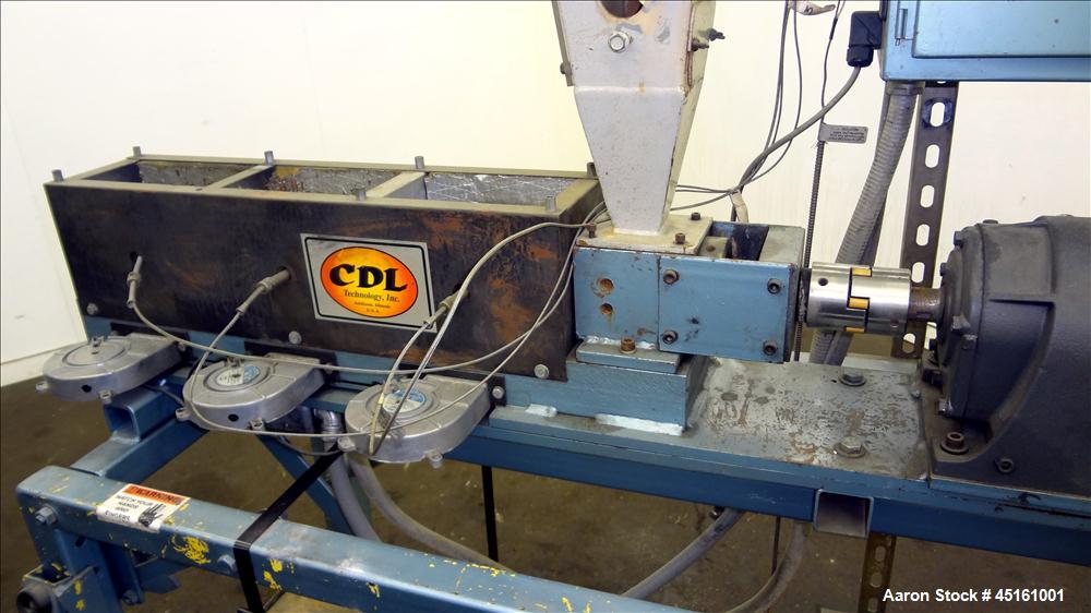 Used Crown / CDL Technology 1" Single Screw Extruder. Approximate 30 to 1 L/D ratio. Electrically heated air cooled 3 zone non-vented barrel. Water cooled feed throat with hopper, approximate 42-1/2"...