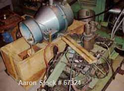 USED: Davis Standard 4.5" single screw extruder, model 45-T. 24:1 L/D ratio, 43" center line, 4 zone electrically heated, air cooled barrel, 4-1/2" x 6" feed throat (no hopper). No motor. Unit includ...