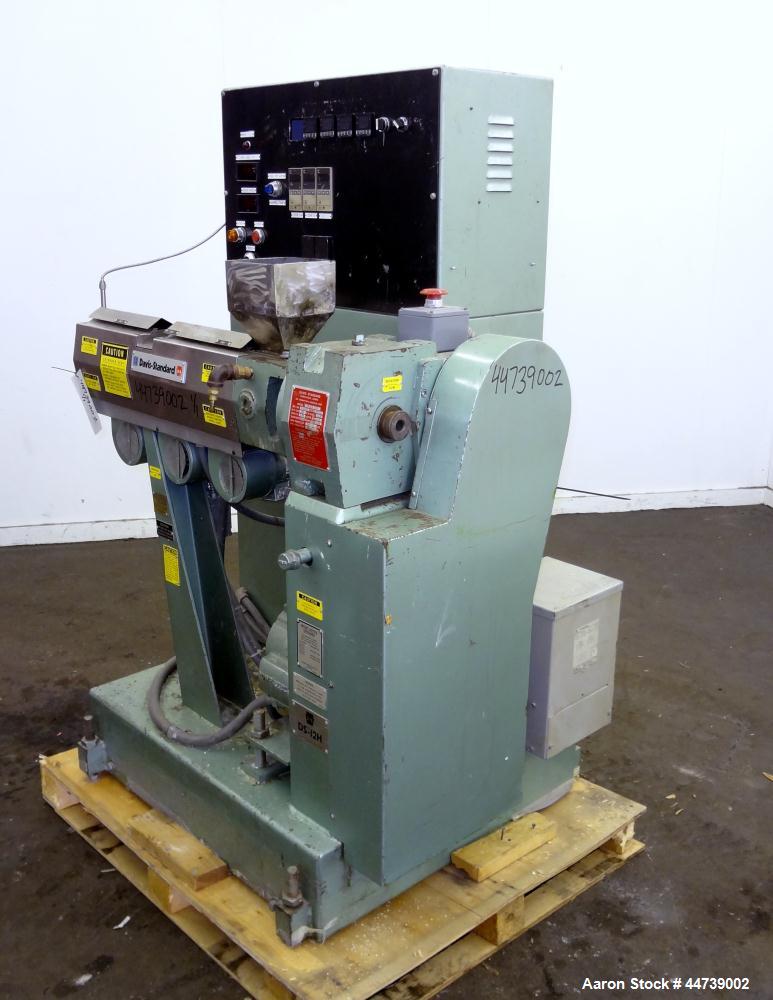 Used Davis Standard 1-1/4" Single Screw Extruder, Model DS-12-HM. Approximate 24 to 1 L/D Ratio. Electrically heated, air cooled 3 zone top vented barrel (plugged). Water cooled feed throat with hopp...