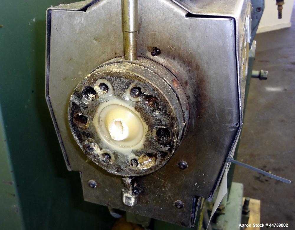 Used Davis Standard 1-1/4" Single Screw Extruder, Model DS-12-HM. Approximate 24 to 1 L/D Ratio. Electrically heated, air cooled 3 zone top vented barrel (plugged). Water cooled feed throat with hopp...