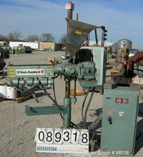 Used Davis Standard 1.25" Pedestal Mounted Single Screw Extruder, Model DS1.25, approximate 24:1 L/D ratio. Electrically heated, air cooled 3 zone non-vented barrel. Water cooled feed throat with hop...