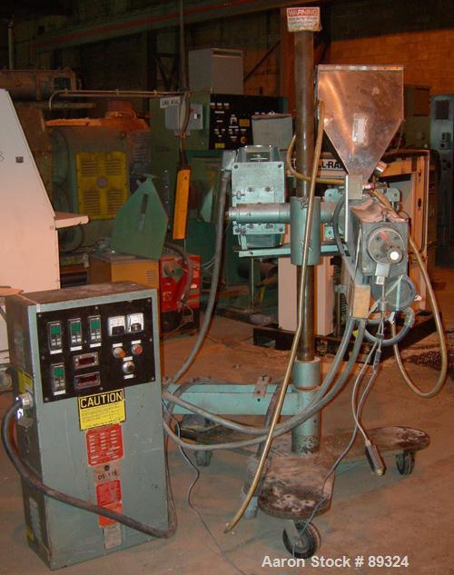 USED: Davis Standard 1.25" pedestal mounted single screw extruder, model DS1.25, approximate 24:1 L/D ratio. Electrically heated, air cooled 3 zone non-vented barrel. Water cooled feed throat with ho...