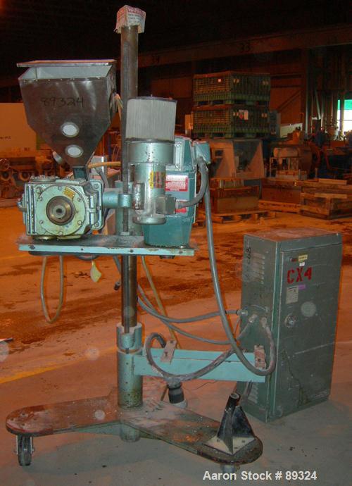 USED: Davis Standard 1.25" pedestal mounted single screw extruder, model DS1.25, approximate 24:1 L/D ratio. Electrically heated, air cooled 3 zone non-vented barrel. Water cooled feed throat with ho...