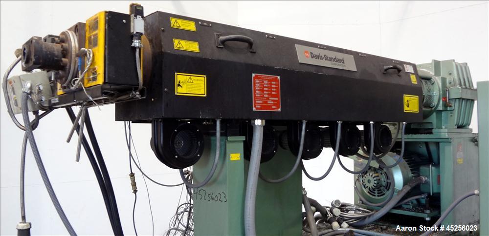 Used Davis Standard 2" Single Screw Extruder, Model KND250. Approximate 30 to 1 L/D ratio. Electrically heated, air cooled 5 zone non-vented barrel. Water cooled feed throat with hopper. Driven by a ...