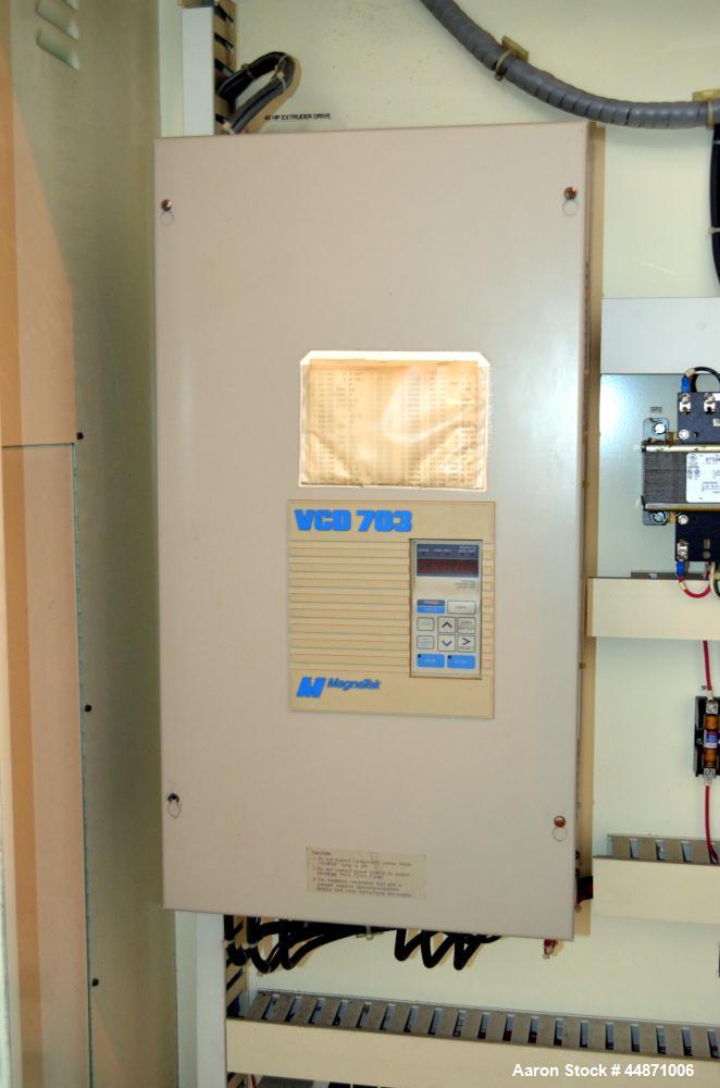 Used Davis Standard 2-1/2" Single Screw Extruder.  Approximately 24 to 1 L/D ratio. Electrically heated, air cooled 4 zone non-vented barrel, water cooled feed throat with hopper.  Driven by a 40 hp,...