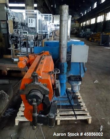 Used Deltaplast 2" Single Screw Cold Feed Extruder. Approximately 24 to 1 L/D ratio, electrically heated, air cooled barrel. Jacketed feed section, pedestal mounted with power roll strip feeder drive...