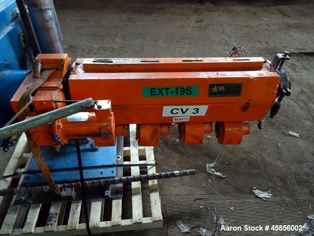 Used Deltaplast 2" Single Screw Cold Feed Extruder. Approximately 24 to 1 L/D ratio, electrically heated, air cooled barrel. Jacketed feed section, pedestal mounted with power roll strip feeder drive...