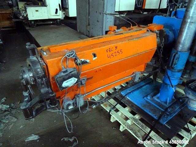 Used Deltaplast 2" Single Screw Cold Feed Extruder. Approximately 24 to 1 L/D ratio, electrically heated, air cooled barrel. Jacketed feed section, pedestal mounted with power roll strip feeder drive...