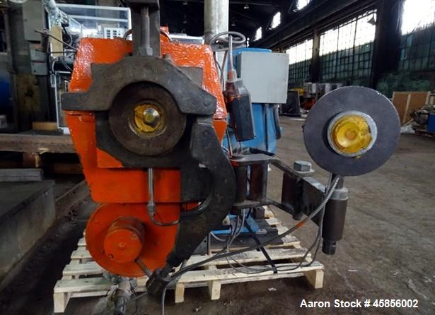 Used Deltaplast 2" Single Screw Cold Feed Extruder. Approximately 24 to 1 L/D ratio, electrically heated, air cooled barrel. Jacketed feed section, pedestal mounted with power roll strip feeder drive...