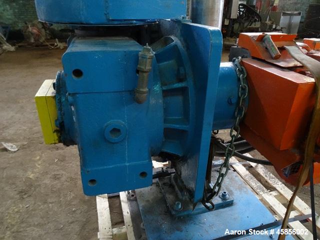 Used Deltaplast 2" Single Screw Cold Feed Extruder. Approximately 24 to 1 L/D ratio, electrically heated, air cooled barrel. Jacketed feed section, pedestal mounted with power roll strip feeder drive...
